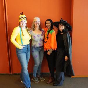 SE Student Affairs Team dressed as (from left to right) Minion, Purple Rain (Prince song), Pumpkin, and Witch